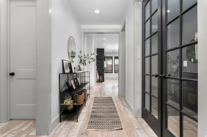 Wood-finish flooring throughout, complemented by recessed lighting