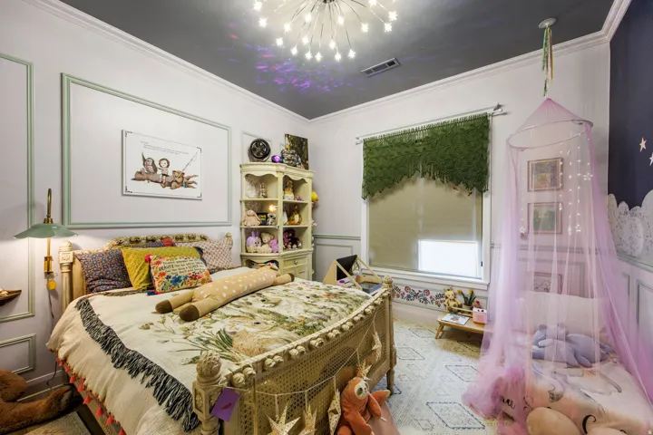 Architectural wall molding details, star-themed ceiling light fixture, recessed lighting, and crown molding