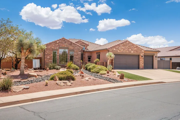 Southwestern-style residence featuring a stone and stucco facade