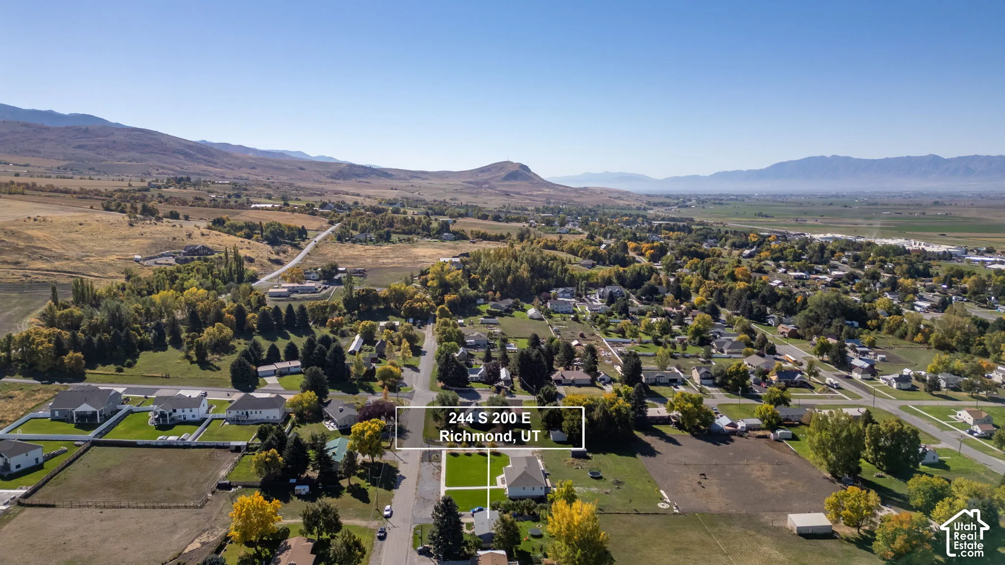 Expansive lot with a rectangular shape, surrounded by paved streets and established homes