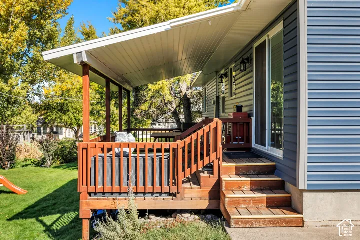 Covered deck with wood-finish railing and posts