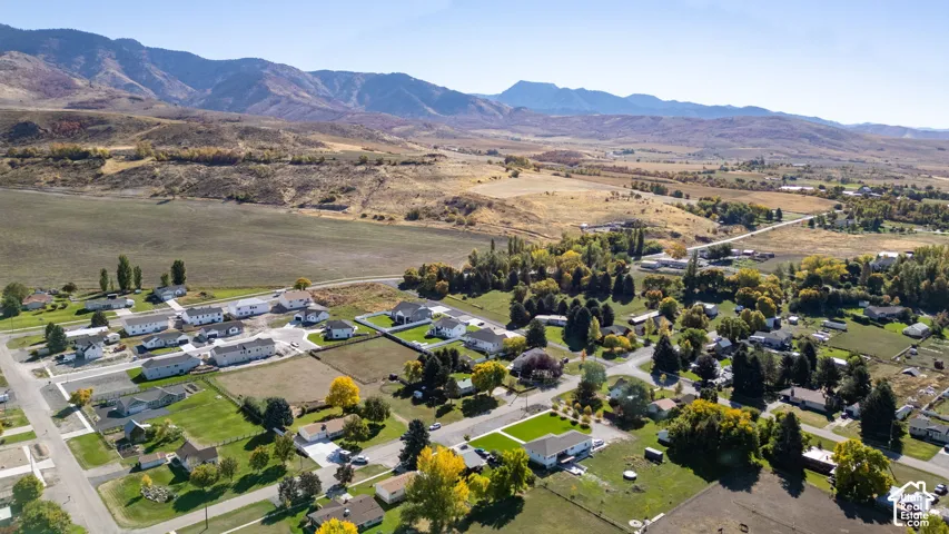 Expansive mountain backdrop with a collection of residential properties
