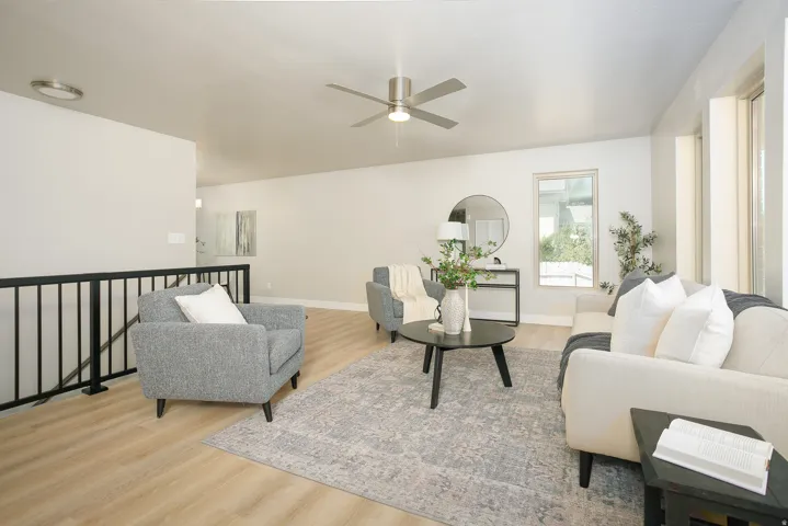 Recessed lighting, wood-finish flooring, ceiling fan, and large windows