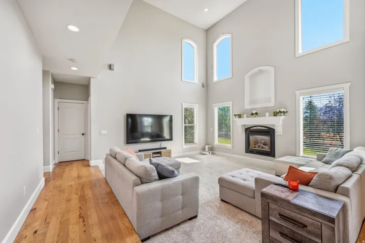 Soaring vaulted ceilings with recessed lighting