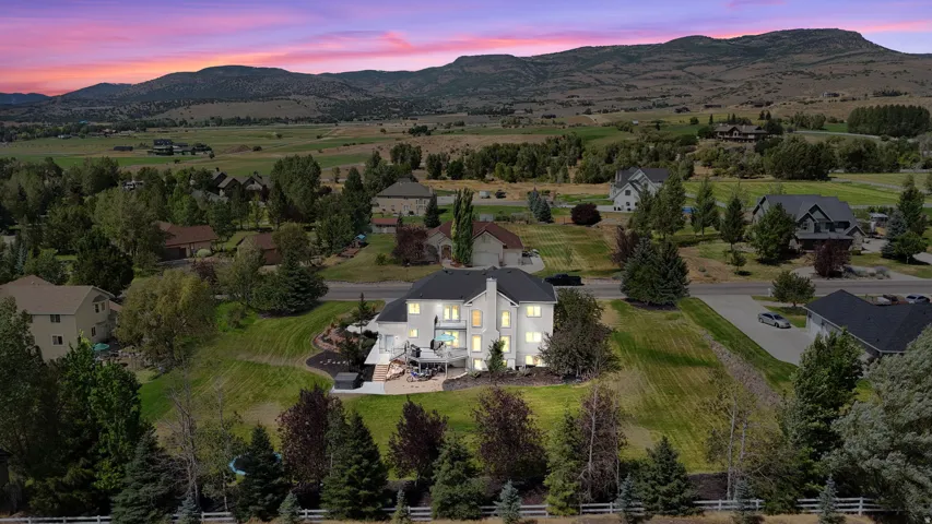 Expansive property with a multi-level structure, a large outdoor patio, and a terraced backyard