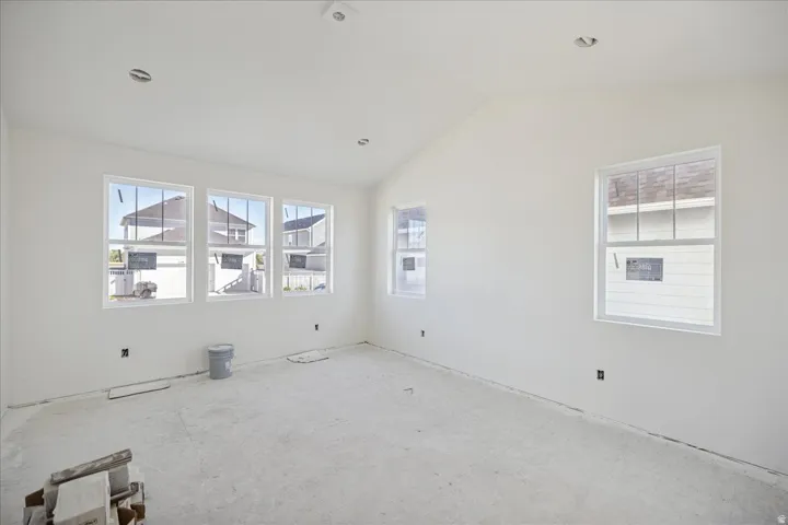 Vaulted ceiling, multiple windows, recessed ceiling lighting