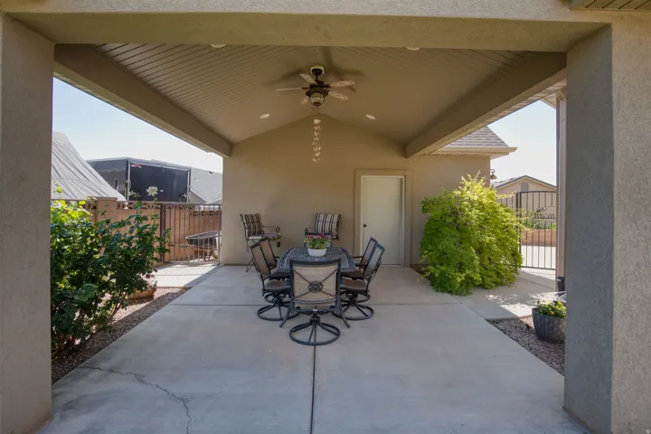 Covered patio featuring a sloped ceiling, recessed lighting, and a ceiling fan