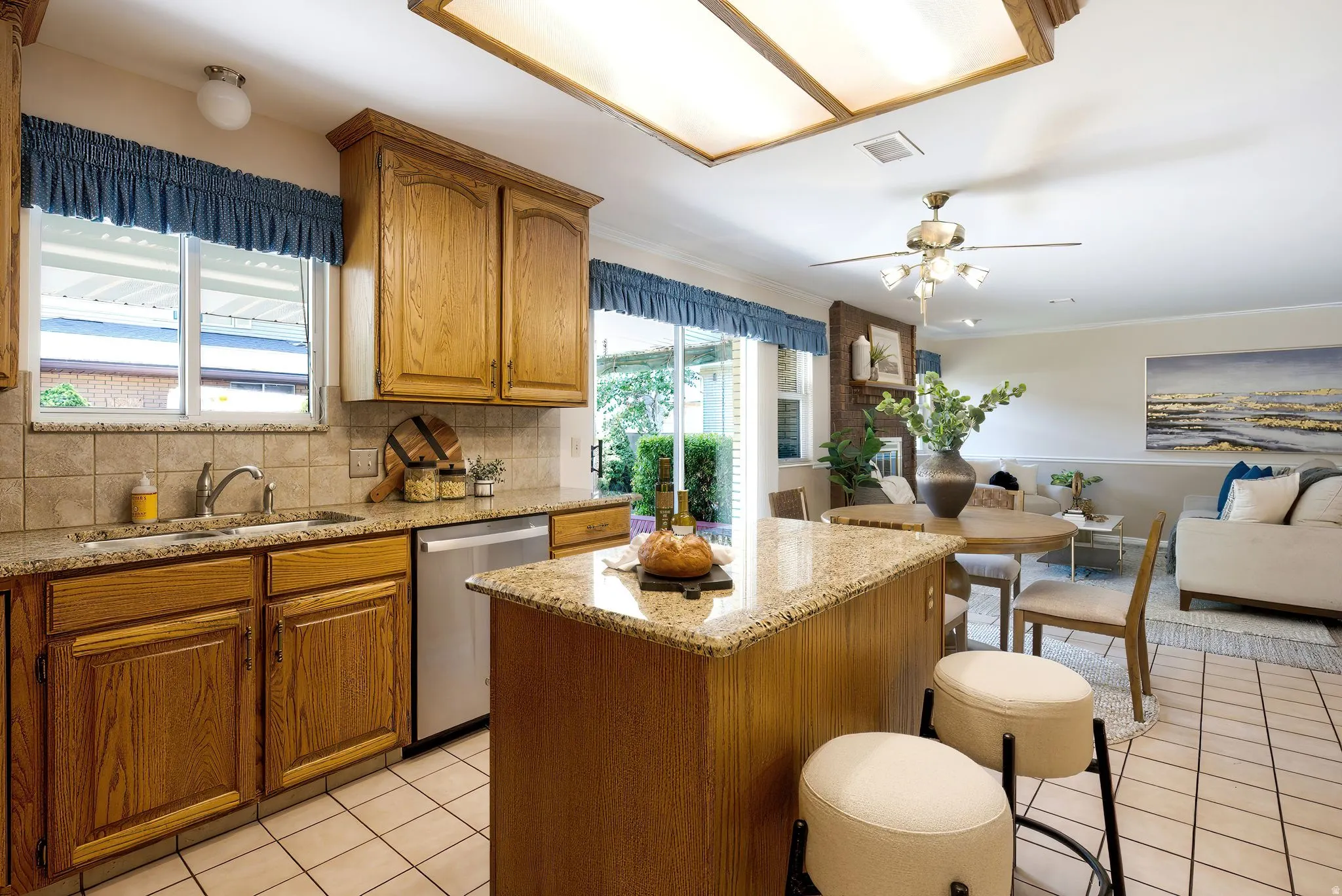 Kitchen featuring wood cabinetry, granite countertops, and a tiled backsplash