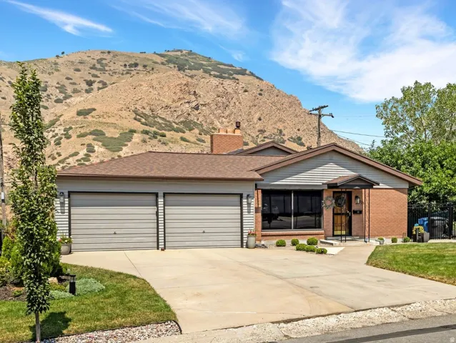 Brick and siding exterior with a two-car garage