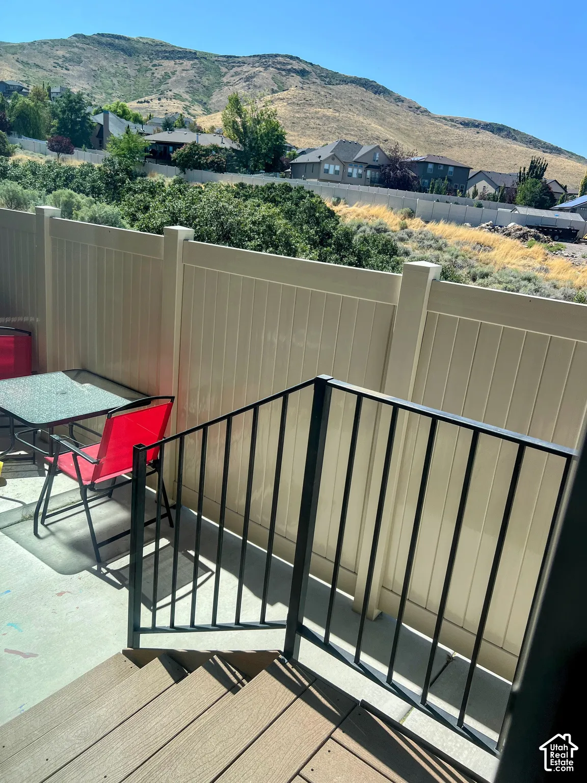 Composite deck stairs with black metal railings
