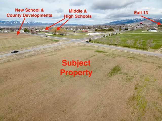 Expansive undeveloped land featuring a rural setting and distant mountain range