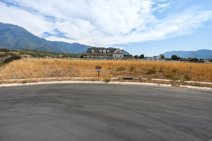 Open land parcel with visible mountain backdrop