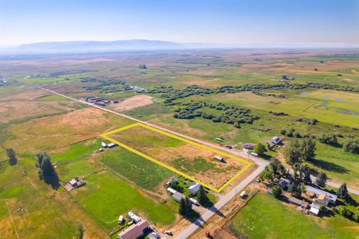 Expansive parcel featuring a rural setting and distant mountain backdrop