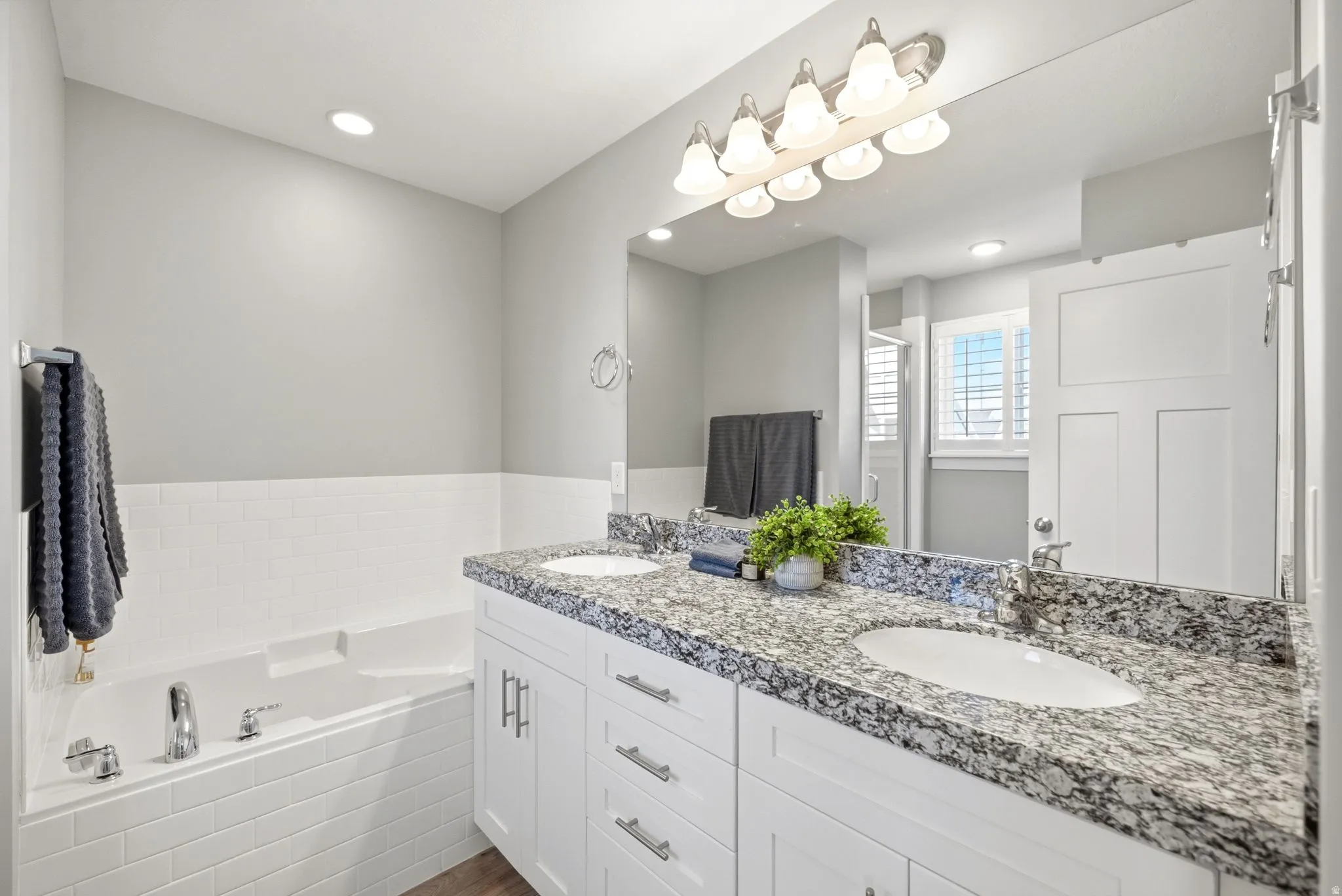 Dual vanity with integrated sinks and granite countertops