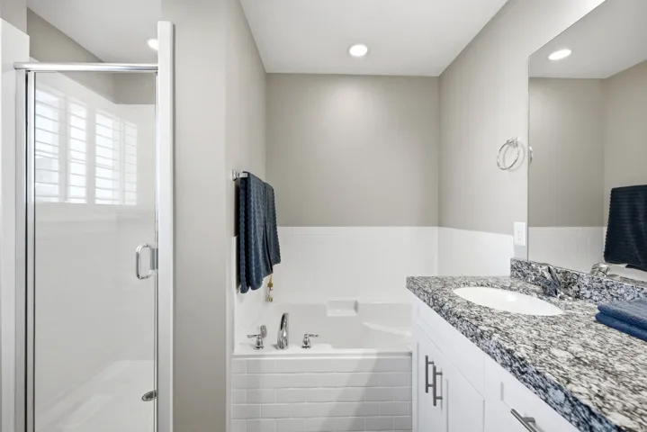 Walk-in shower with clear glass enclosure