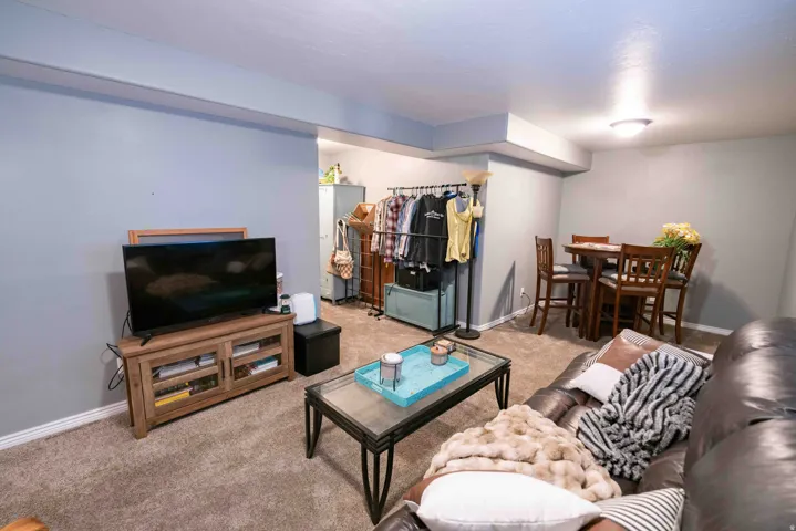 Carpeted flooring throughout, recessed ceiling lighting, and light gray wall paint