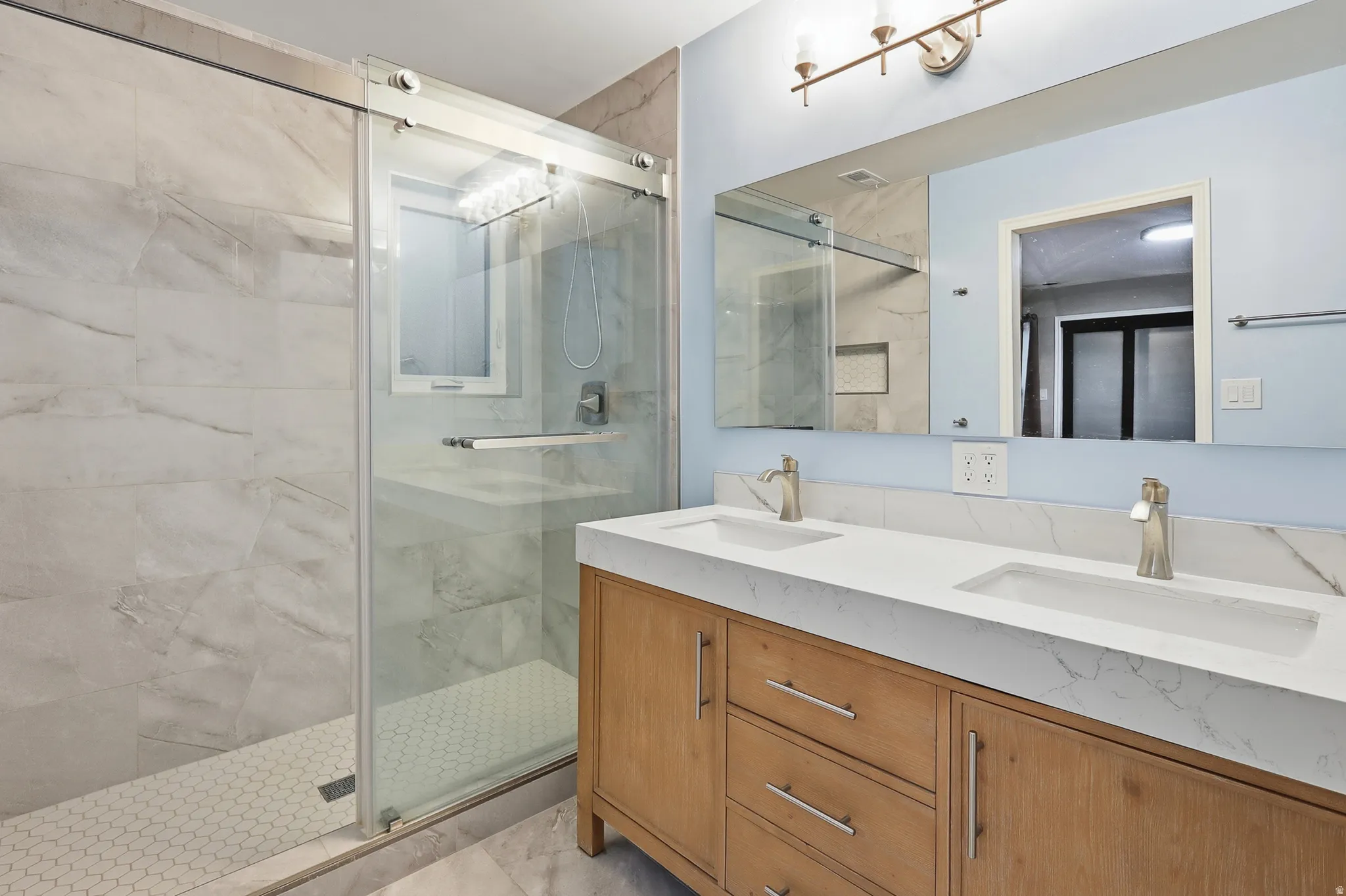 Dual vanity with undermount sinks and modern faucets