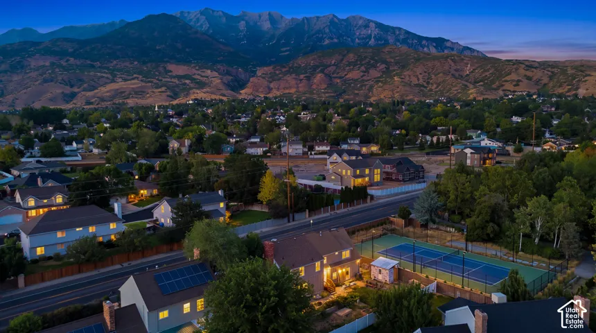 Aerial perspective of a neighborhood with mountain backdrop