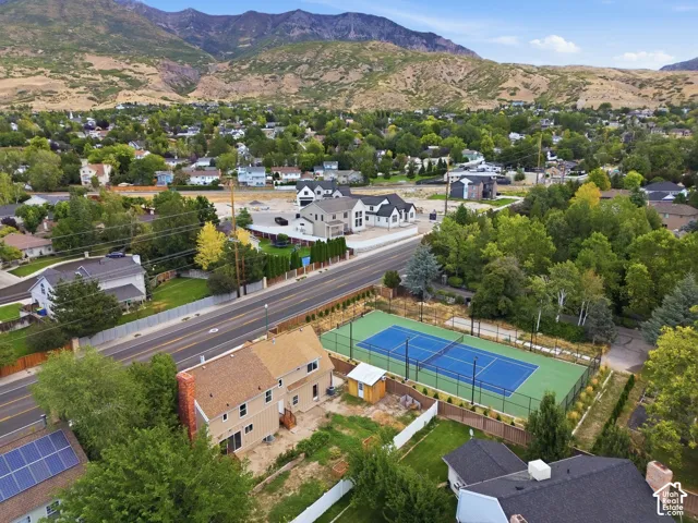 Property with tennis courts, adjacent to a paved road