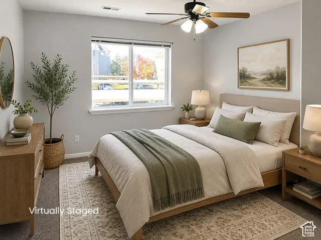 Recessed lighting, ceiling fan with light fixture, large window, carpet flooring, and neutral wall tones