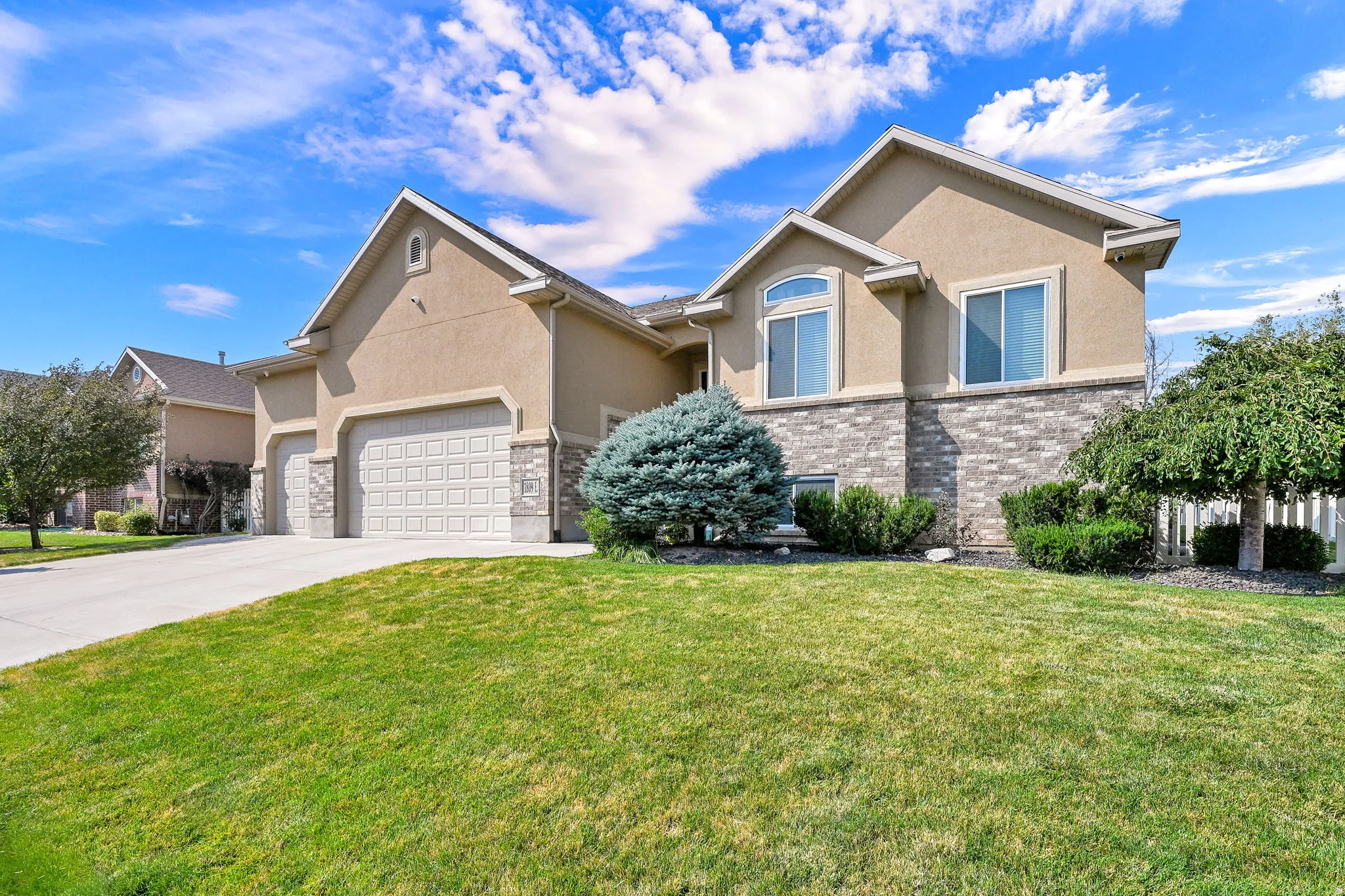 Stucco exterior with stone veneer accents