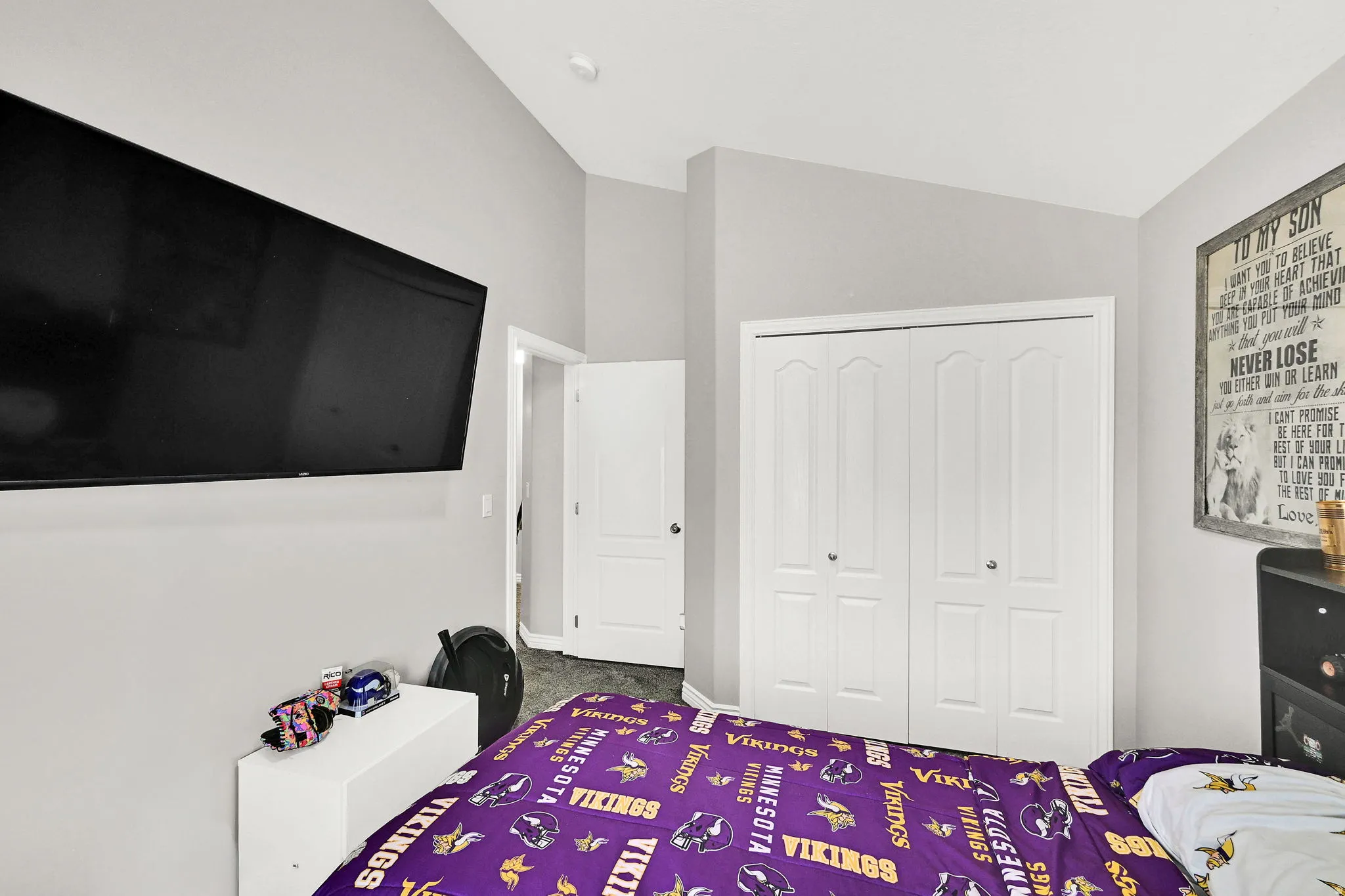 Vaulted ceiling and light gray wall finish