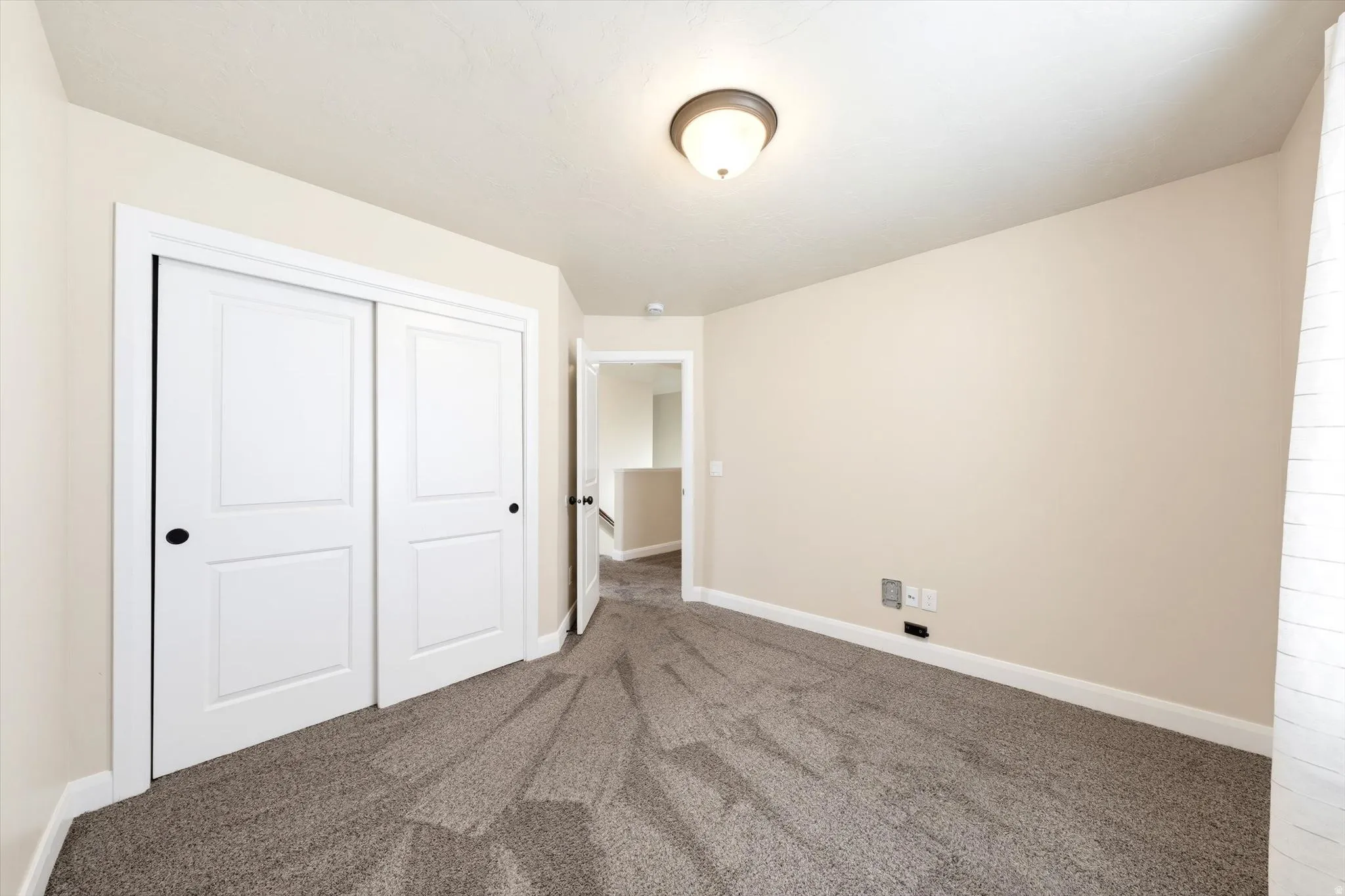 Neutral-toned carpeting throughout