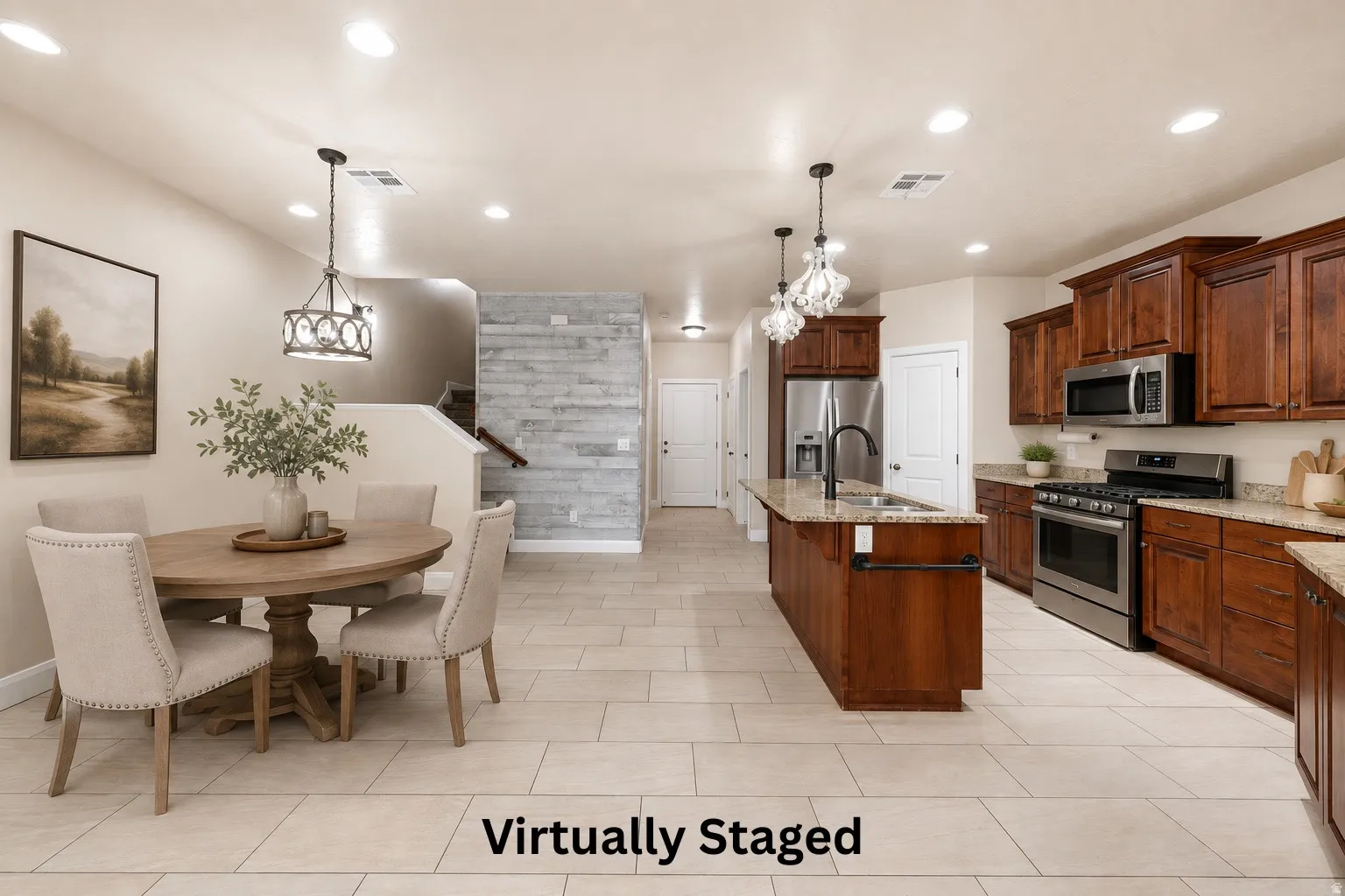 Open-concept layout featuring wood-finish cabinetry, stainless steel appliances, a kitchen island with sink, and light-toned tile flooring