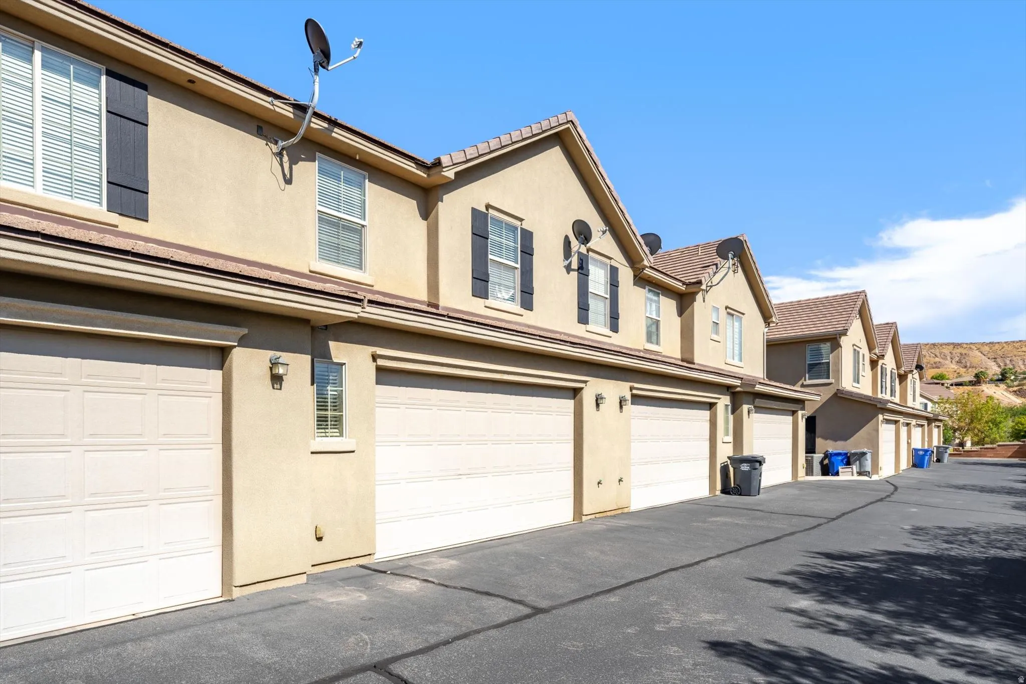 Multiple attached garages with panel doors