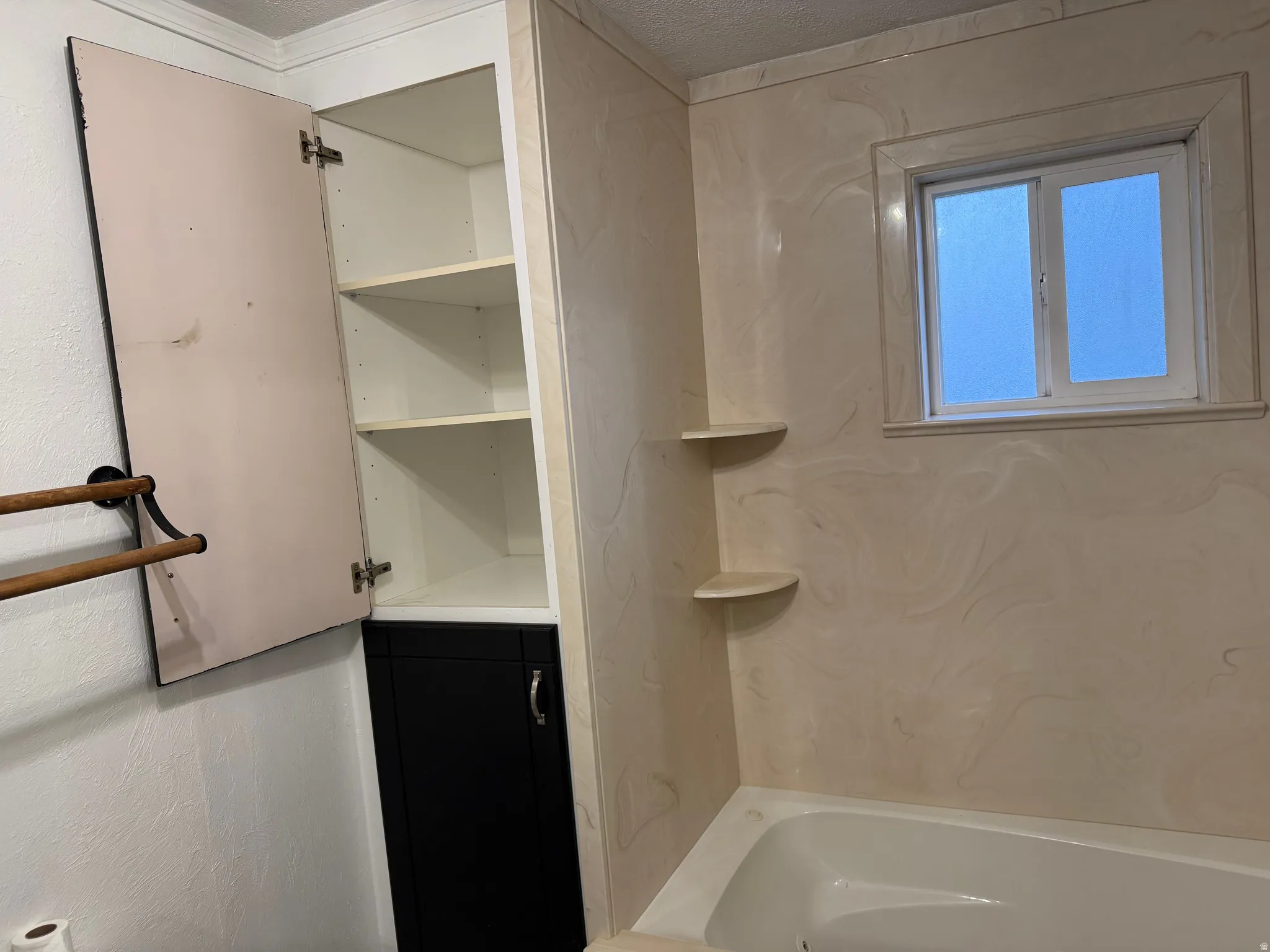 Built-in wall cabinetry with shelving, complete with a lower storage cabinet