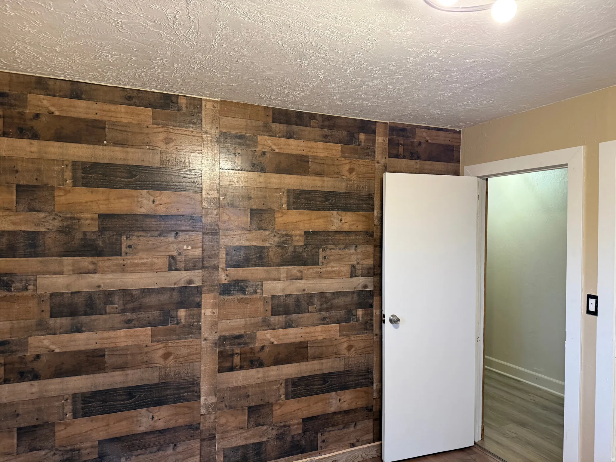 Wood-finish accent wall with varied tones