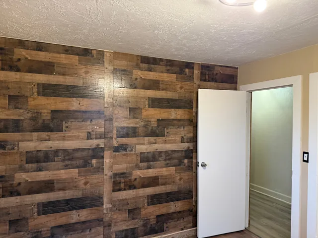 Wood-finish accent wall with varied tones