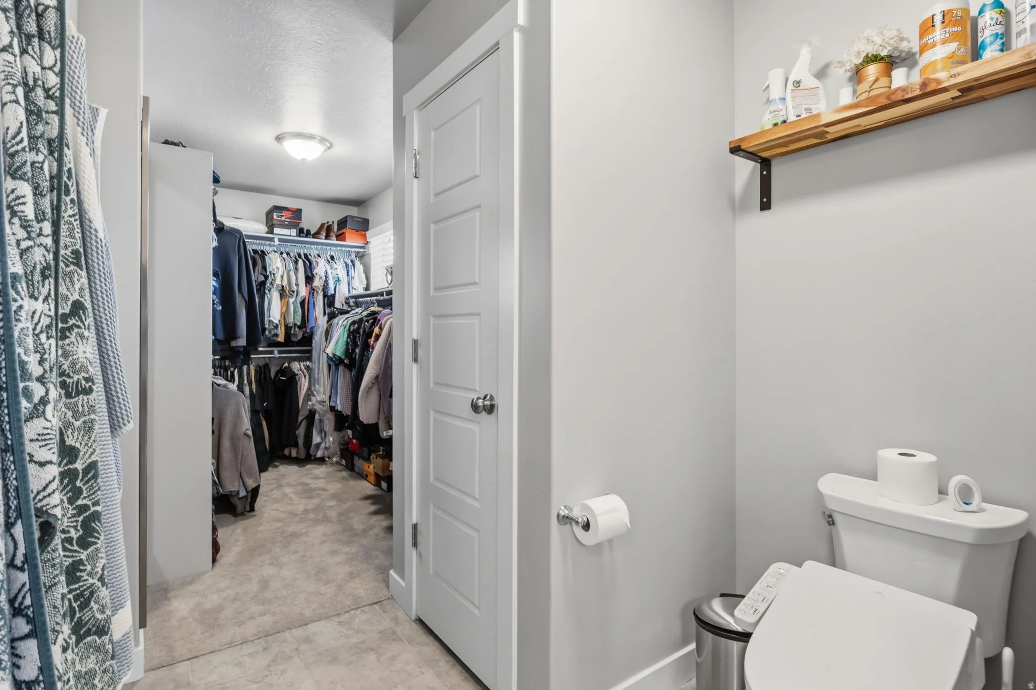 Walk-in closet with built-in shelving and hanging rods