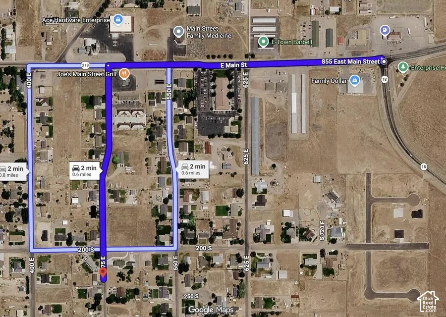 Satellite Map. Displaying a route calculation with distance and estimated travel time, indicating various street names and commercial establishments