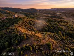 Vast undeveloped land featuring natural terrain and distant hills
