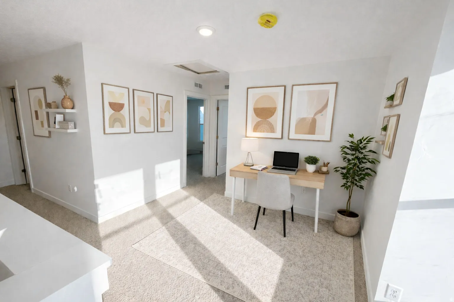 Recessed lighting, light-toned carpeting, white painted walls, and white trim throughout