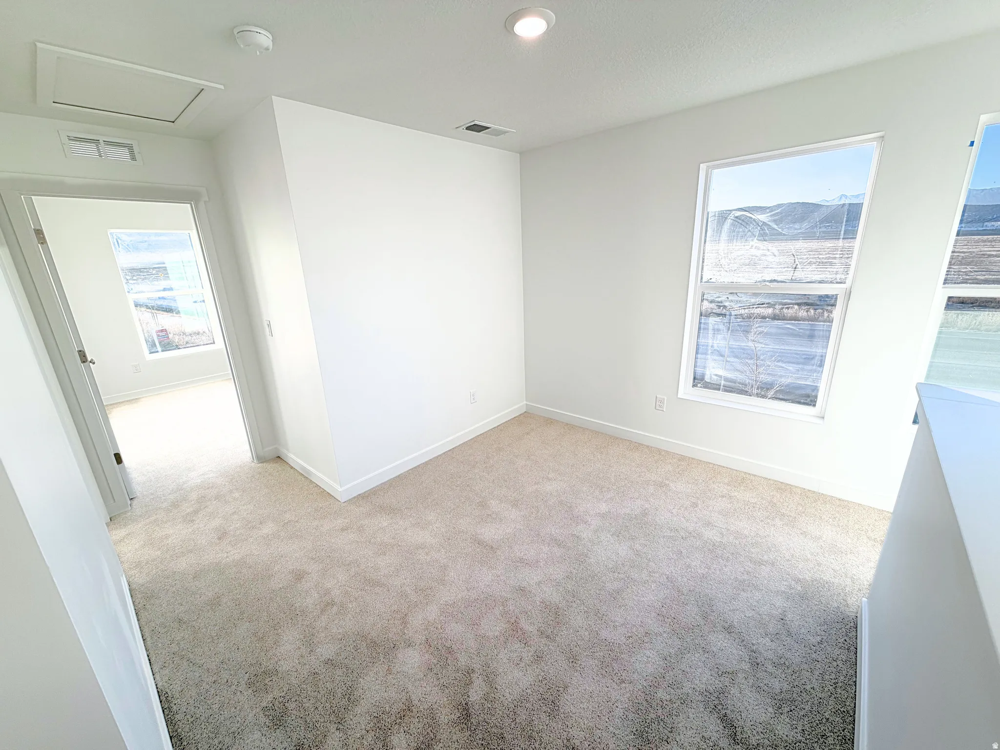Neutral-toned carpeting throughout