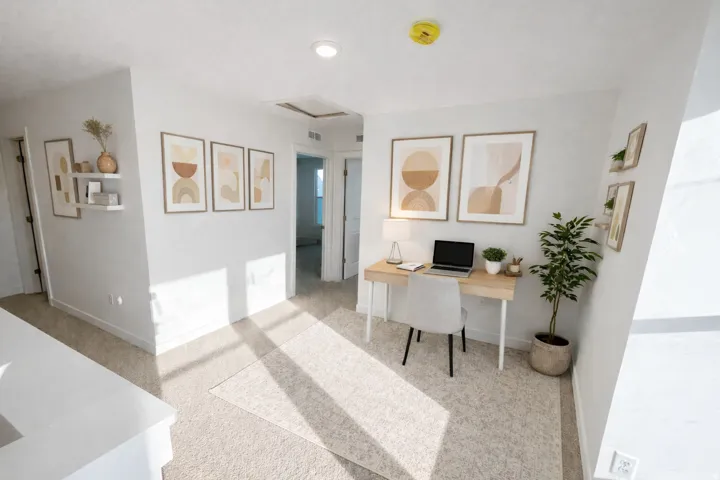 Recessed lighting, light-toned carpeting, white painted walls, and white trim throughout