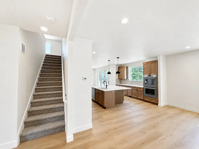 Expansive main living area with wood-finish flooring