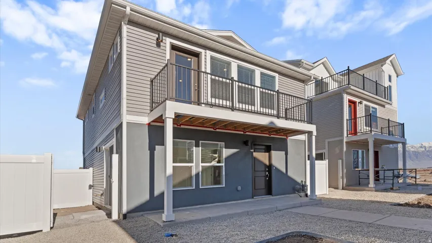 Multi-level exterior with horizontal siding and a lower stucco finish