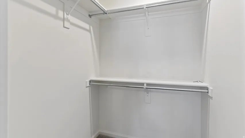 Integrated closet storage featuring multiple shelving and hanging rods