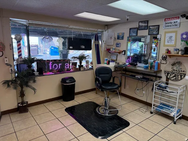 Front-facing retail space featuring large storefront windows, recessed ceiling lighting, and neutral-toned wall paint
