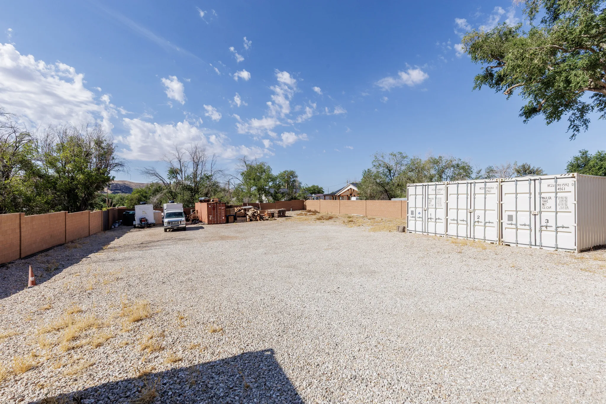 Fenced yard — gravel storage field