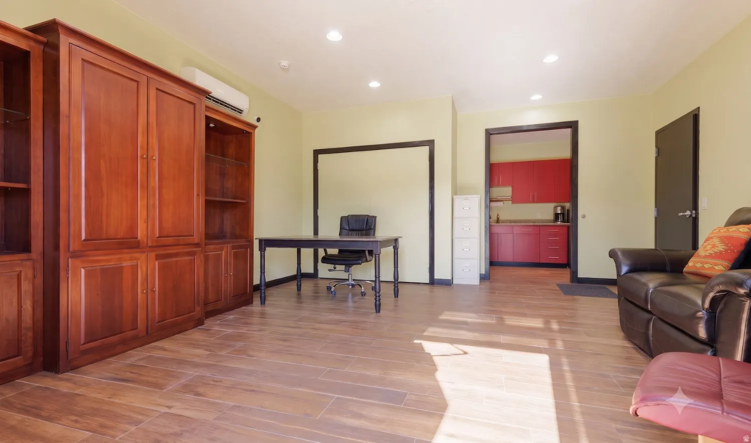 Suite 7 office toward kitchenette — built-in cabinetry