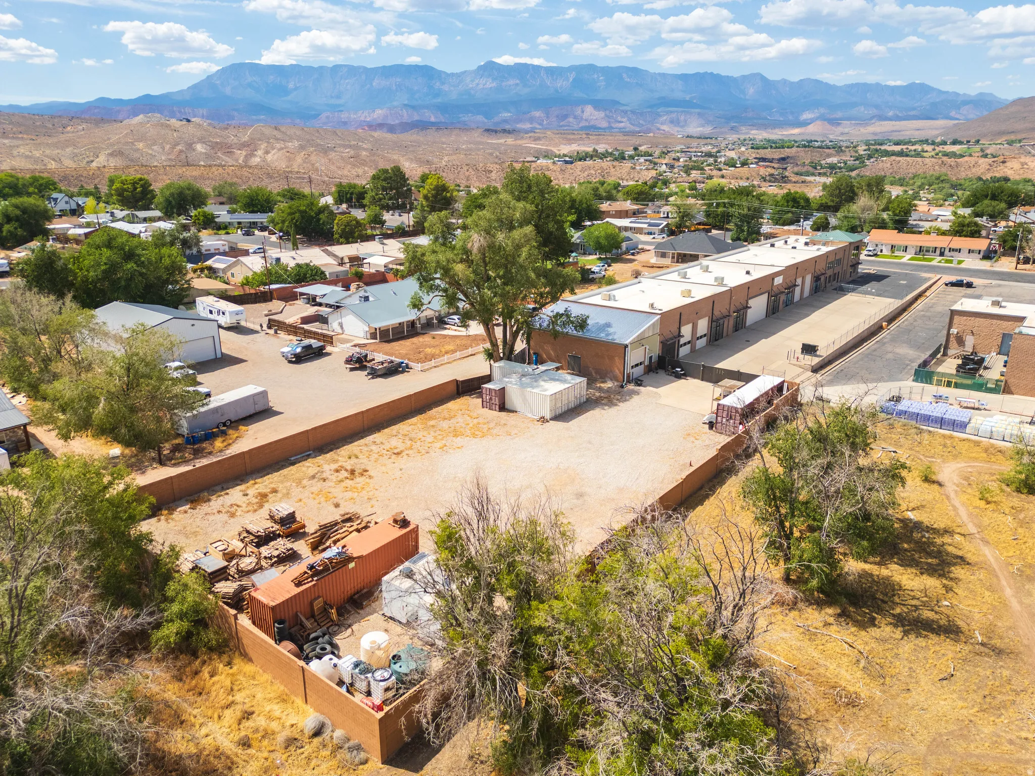 Aerial — full site and gated yard