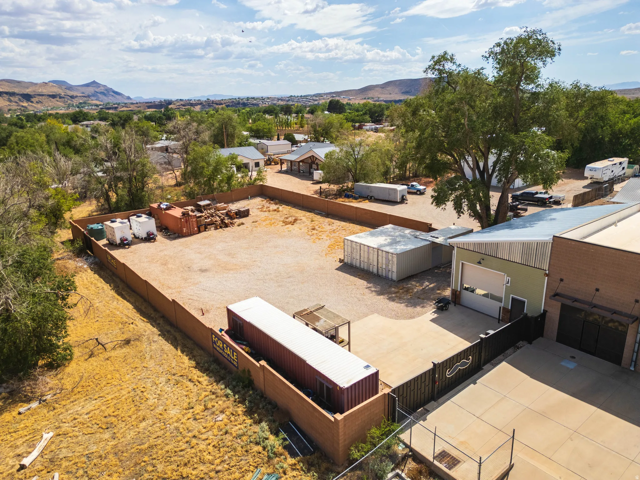 Aerial — building and fenced yard