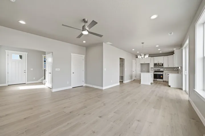 Spacious open-concept layout with wood-finish flooring