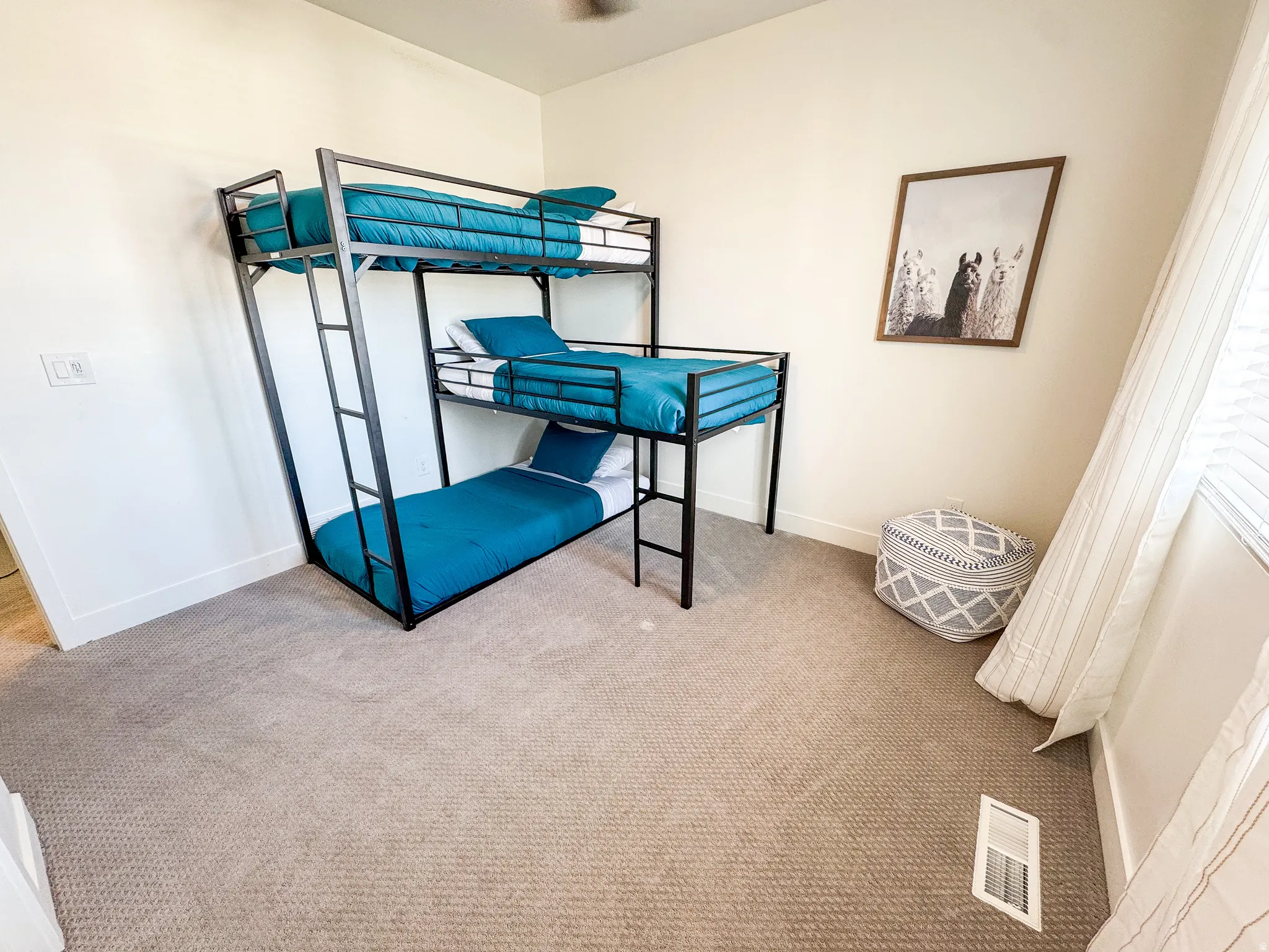 Plush carpeting and crisp white walls create a bright interior