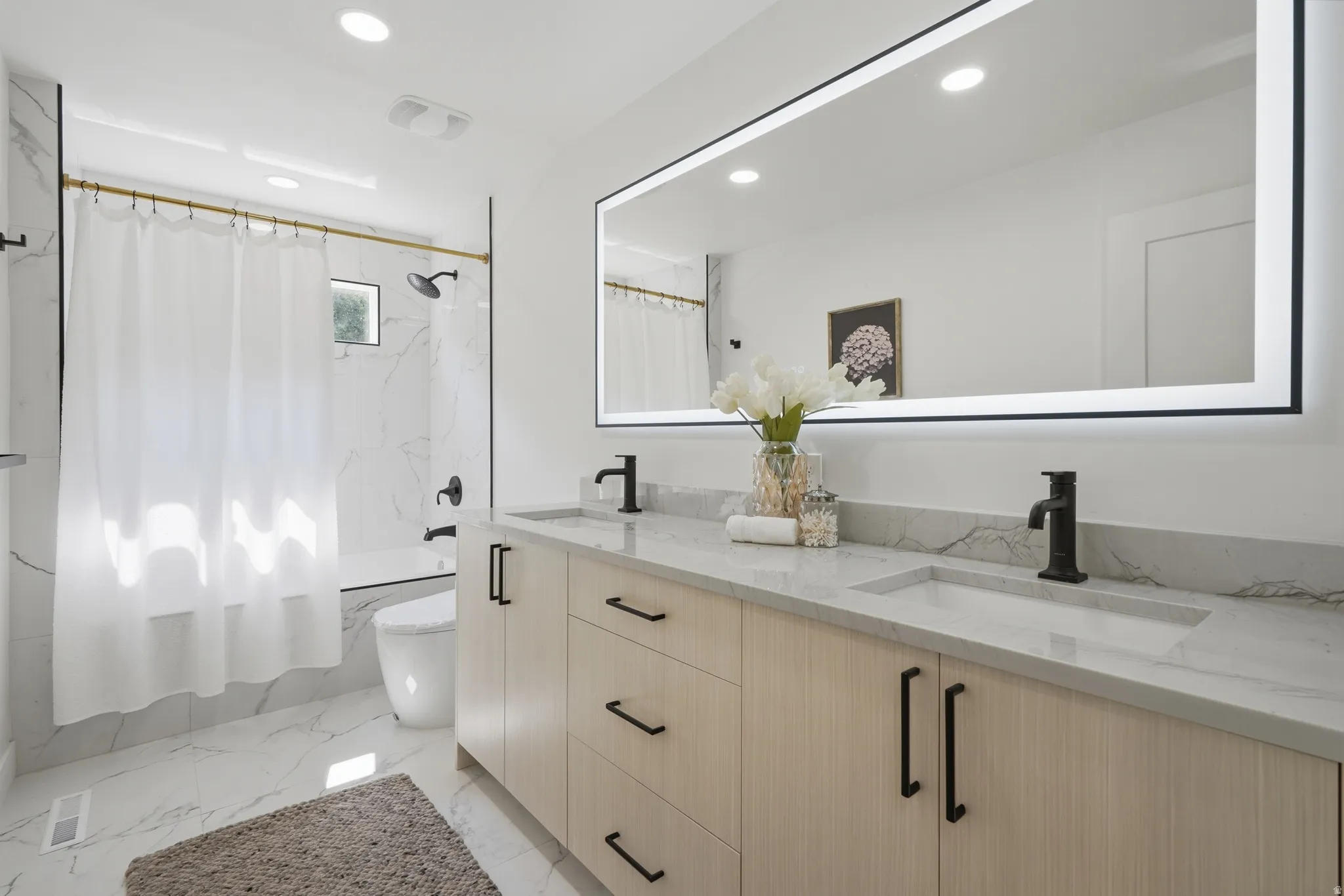 Dual vanity with integrated sinks and matte black fixtures