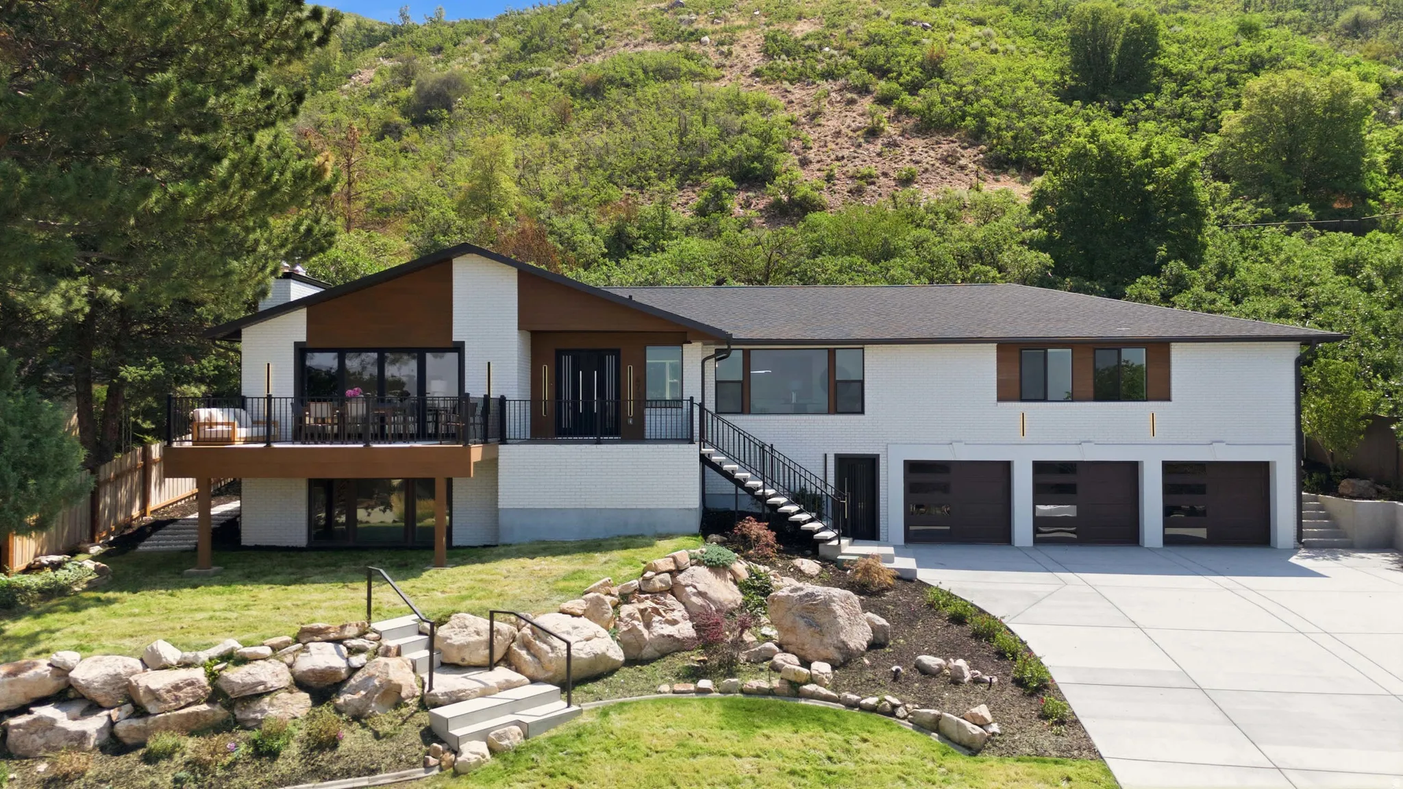 Contemporary exterior with white stucco and wood-finish siding